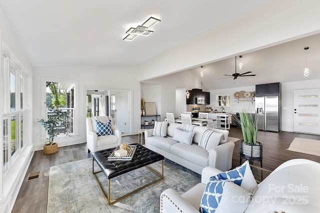 9115 Clement Cir, Terrell, NC 28682 - living area with vaulted ceiling, dark wood-style floors, and a ceiling fan