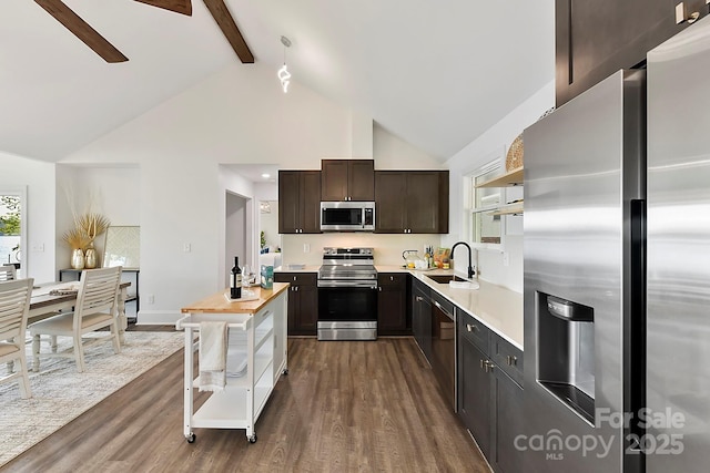 9115 Clement Cir, Terrell, NC 28682 - kitchen featuring appliances with stainless steel finishes, a sink, light countertops, dark wood-style flooring, and high vaulted ceiling