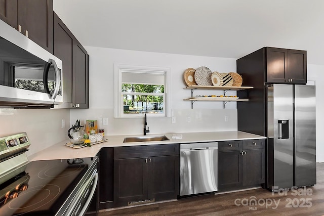 9115 Clement Cir, Terrell, NC 28682 - kitchen featuring appliances with stainless steel finishes, a sink, open shelves, dark wood finished floors, and light countertops