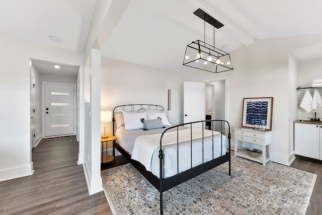 9115 Clement Cir, Terrell, NC 28682 - bedroom with dark wood finished floors, baseboards, a chandelier, a sink, and recessed lighting
