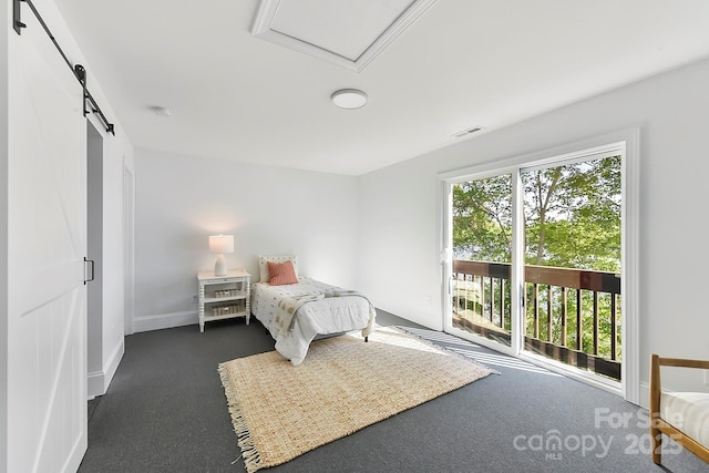 9115 Clement Cir, Terrell, NC 28682 - carpeted bedroom featuring access to exterior, a barn door, and baseboards