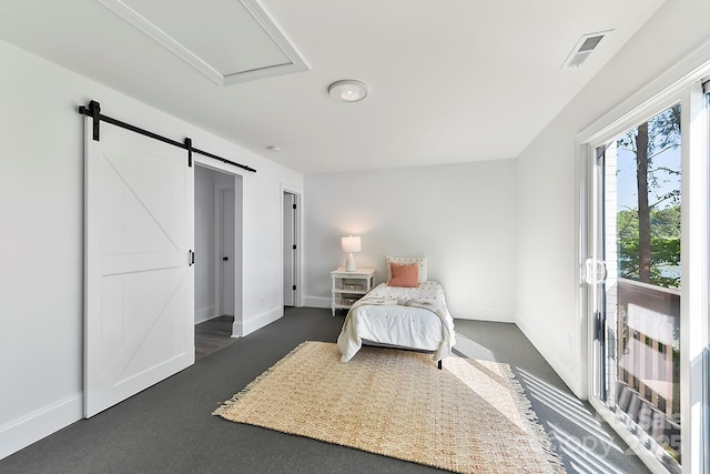 9115 Clement Cir, Terrell, NC 28682 - bedroom featuring dark colored carpet, a barn door, and baseboards