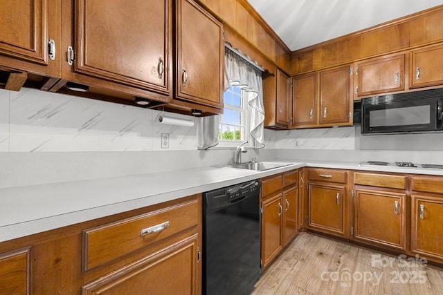 12117 Idlewild Rd, Matthews, NC 28105 - kitchen with black appliances and brown cabinetry