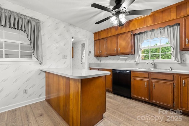 12117 Idlewild Rd, Matthews, NC 28105 - kitchen featuring black dishwasher, wallpapered walls, a sink, brown cabinetry, and light countertops