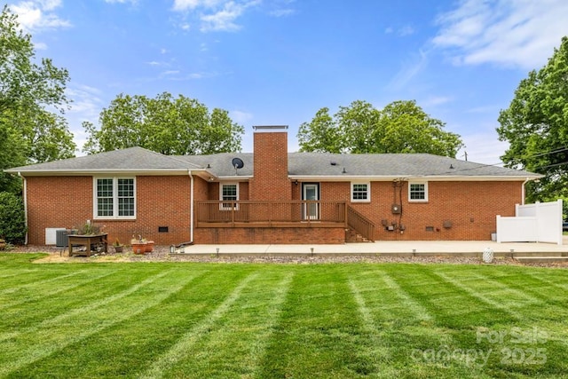 12117 Idlewild Rd, Matthews, NC 28105 - back of house with a deck, a lawn, a chimney, and brick siding