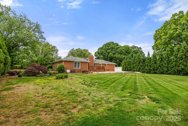 12117 Idlewild Rd, Matthews, NC 28105 - view of grassy yard with a patio