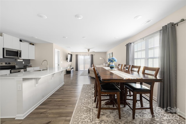 2754 Legacy Ridge Ln, Catawba, NC 28609 - dining area with ceiling fan, dark wood finished floors, and baseboards