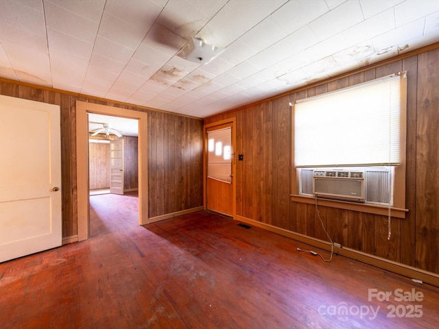 1470 Hilltop St, Albemarle, NC 28001 - entryway featuring cooling unit, wooden walls, and wood-type flooring