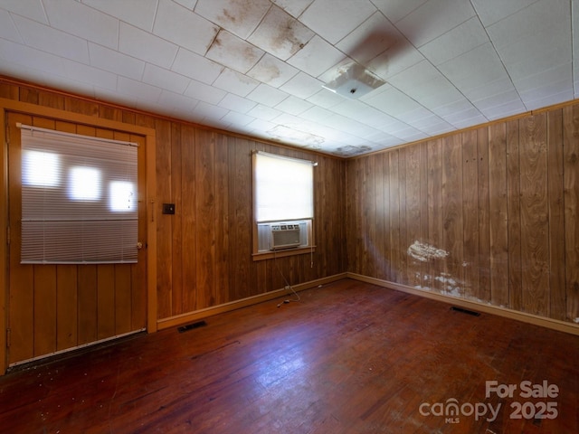 1470 Hilltop St, Albemarle, NC 28001 - entryway featuring wooden walls, cooling unit, visible vents, and wood finished floors