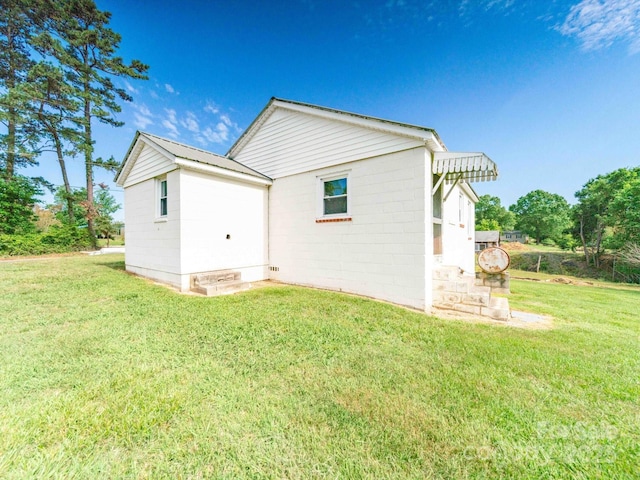 1470 Hilltop St, Albemarle, NC 28001 - rear view of property featuring concrete block siding and a lawn