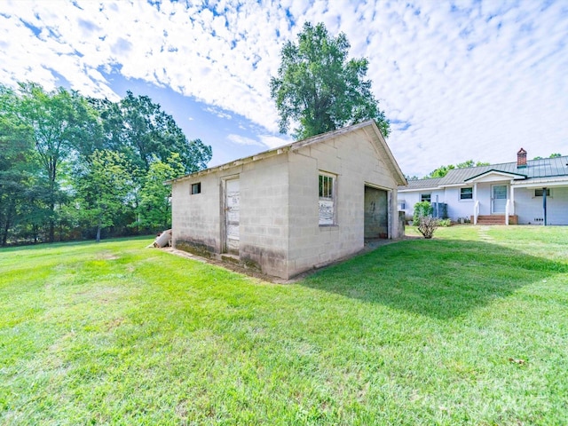 1470 Hilltop St, Albemarle, NC 28001 - view of home's exterior with a yard, an outdoor structure, a chimney, and a detached garage