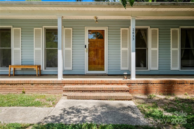doorway to property featuring a porch