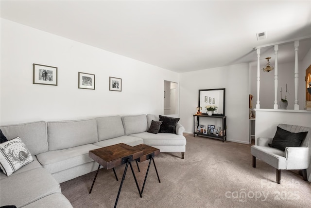 living area with light carpet and visible vents
