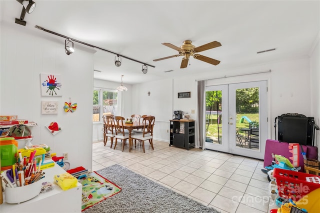 recreation room featuring light tile patterned floors, french doors, a ceiling fan, rail lighting, and visible vents
