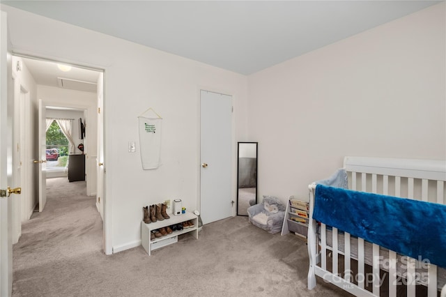 bedroom featuring light colored carpet