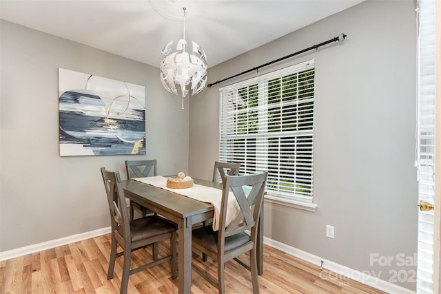 10421 Columbia Crest Ct, Charlotte, NC 28270 - dining space featuring a chandelier and wood finished floors