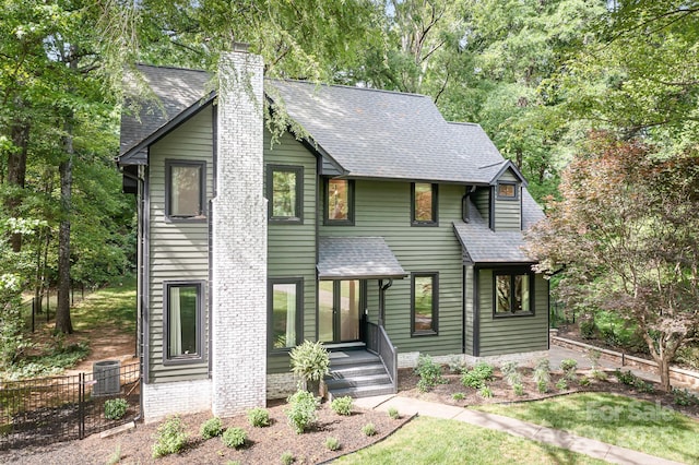 4316 Old Saybrook Ct, Charlotte, NC 28211 - view of front of property featuring roof with shingles, a chimney, fence, and central AC unit