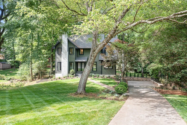 4316 Old Saybrook Ct, Charlotte, NC 28211 - view of front of house with a front yard, roof with shingles, and a chimney