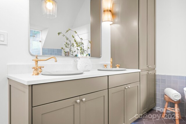 4316 Old Saybrook Ct, Charlotte, NC 28211 - bathroom featuring double vanity, tile patterned floors, and tile walls