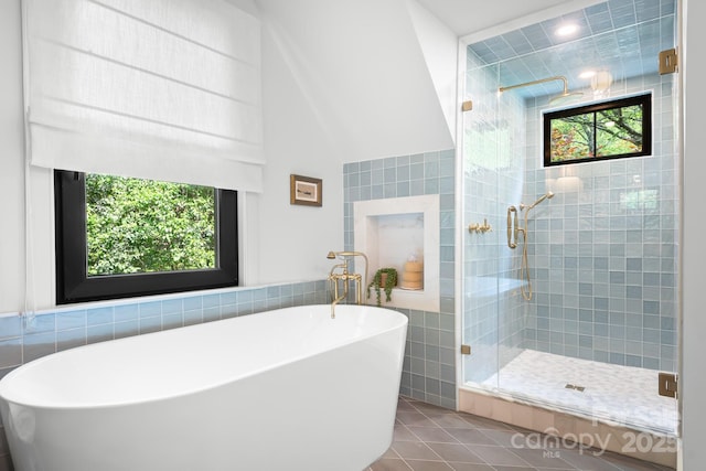 4316 Old Saybrook Ct, Charlotte, NC 28211 - bathroom featuring tile walls, plenty of natural light, a shower stall, tile patterned flooring, and a freestanding bath