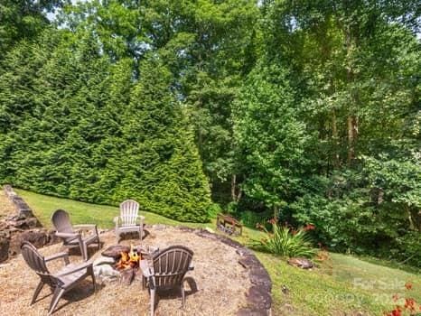 55 Christine Ct, Waynesville, NC 28786 - view of yard featuring a fire pit