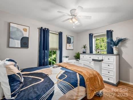55 Christine Ct, Waynesville, NC 28786 - bedroom featuring light wood finished floors and ceiling fan