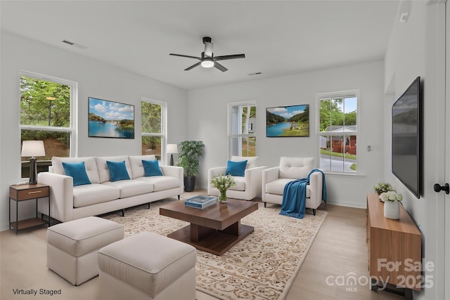 518 Herms Ave, Mount Holly, NC 28120 - living room featuring a ceiling fan, light wood-style flooring, and baseboards