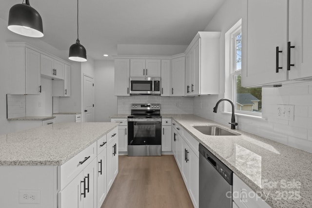 518 Herms Ave, Mount Holly, NC 28120 - kitchen featuring appliances with stainless steel finishes, a sink, light stone counters, white cabinetry, and recessed lighting