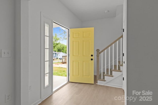 518 Herms Ave, Mount Holly, NC 28120 - foyer entrance with light wood finished floors, stairs, and baseboards