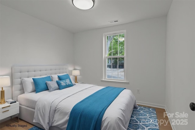 518 Herms Ave, Mount Holly, NC 28120 - bedroom featuring wood finished floors and baseboards