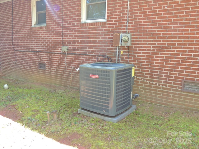 exterior details with central air condition unit and crawl space