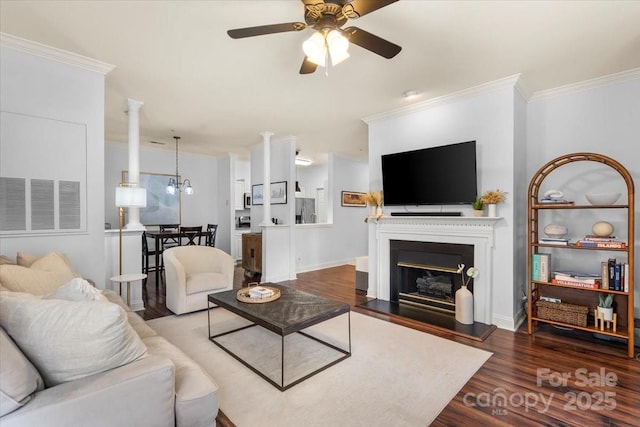 5730 Closeburn Rd Unit H, Charlotte, NC 28210 - living area with wood finished floors, a ceiling fan, ornamental molding, a glass covered fireplace, and baseboards