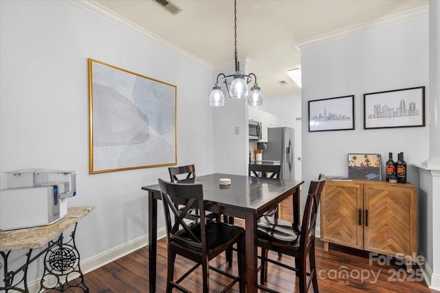 5730 Closeburn Rd Unit H, Charlotte, NC 28210 - dining area featuring dark wood-type flooring, crown molding, and baseboards