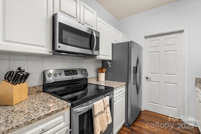 5730 Closeburn Rd Unit H, Charlotte, NC 28210 - kitchen with stainless steel appliances, white cabinetry, decorative backsplash, and light stone countertops