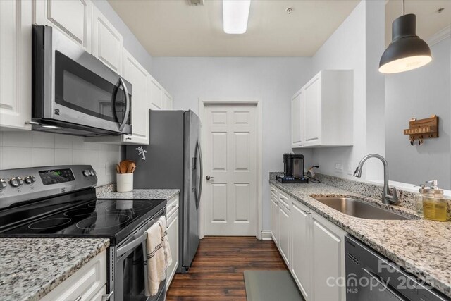 5730 Closeburn Rd Unit H, Charlotte, NC 28210 - kitchen featuring stainless steel appliances, a sink, dark wood-type flooring, white cabinets, and tasteful backsplash