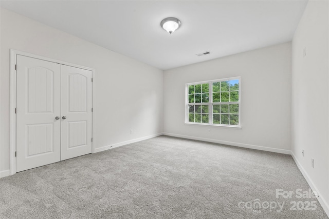 8505 Loxton Cir, Charlotte, NC 28214 - carpeted empty room with visible vents and baseboards