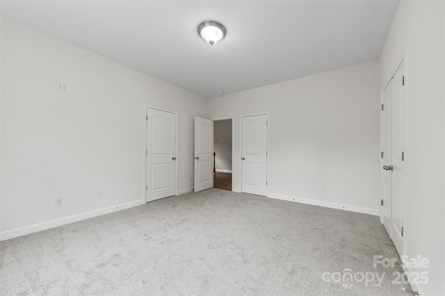 8505 Loxton Cir, Charlotte, NC 28214 - unfurnished bedroom with carpet floors and baseboards