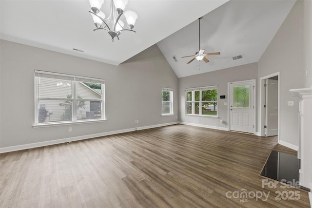 8505 Loxton Cir, Charlotte, NC 28214 - unfurnished living room with high vaulted ceiling, ceiling fan with notable chandelier, visible vents, and wood finished floors