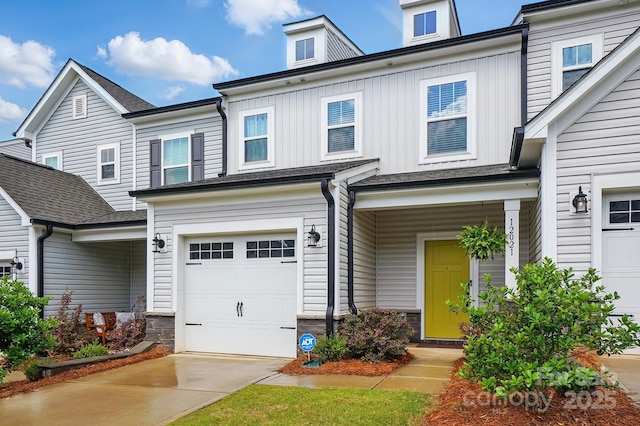 12021 Basking Dr, Charlotte, NC 28214 - view of front of house featuring a garage, board and batten siding, stone siding, and concrete driveway