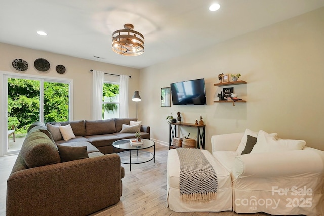 12021 Basking Dr, Charlotte, NC 28214 - living room featuring recessed lighting, light wood finished floors, and baseboards