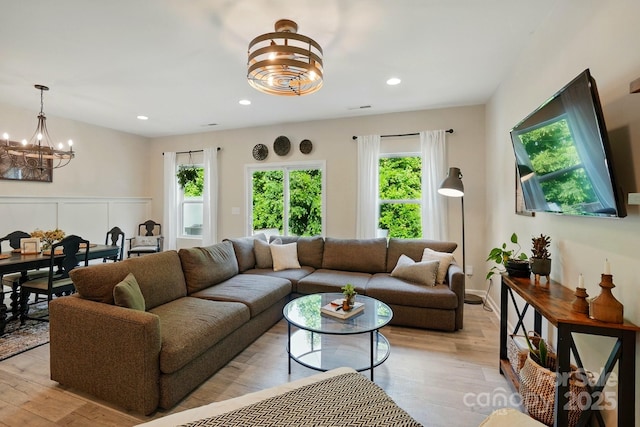 12021 Basking Dr, Charlotte, NC 28214 - living area featuring a chandelier, light wood-style floors, and recessed lighting