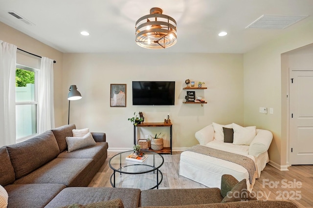 12021 Basking Dr, Charlotte, NC 28214 - living area with light wood-type flooring, baseboards, and recessed lighting