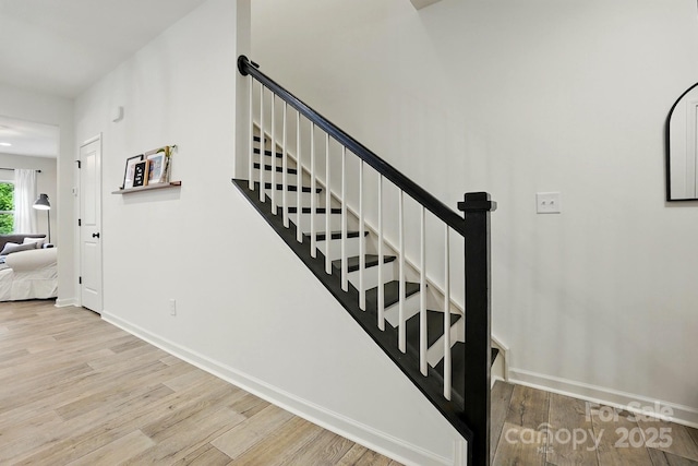 12021 Basking Dr, Charlotte, NC 28214 - staircase featuring wood finished floors and baseboards