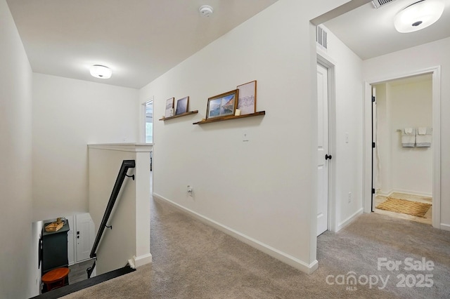 12021 Basking Dr, Charlotte, NC 28214 - hall featuring an upstairs landing, carpet flooring, and baseboards