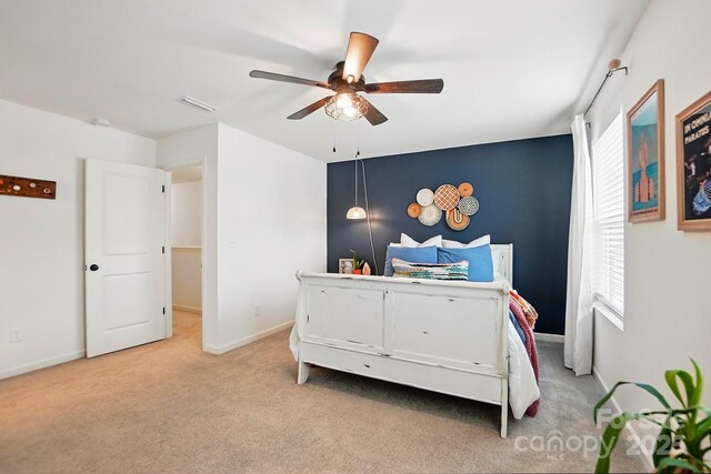 12021 Basking Dr, Charlotte, NC 28214 - bedroom featuring light colored carpet, multiple windows, baseboards, and a ceiling fan