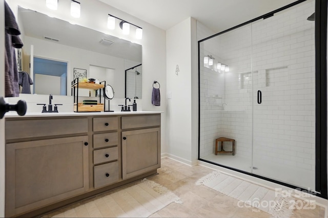 12021 Basking Dr, Charlotte, NC 28214 - full bath with a shower stall, double vanity, tile patterned flooring, and baseboards