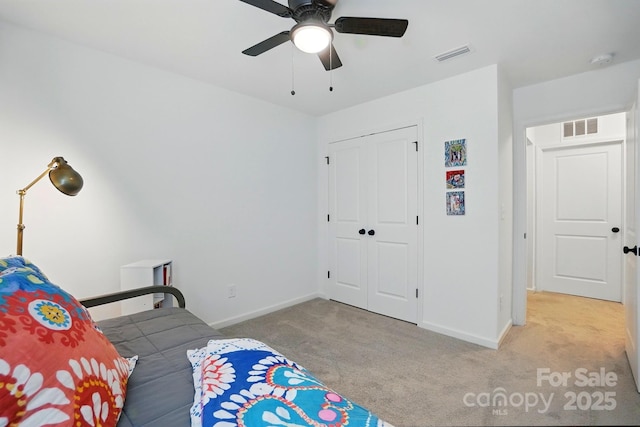 12021 Basking Dr, Charlotte, NC 28214 - bedroom featuring carpet, baseboards, a closet, and ceiling fan