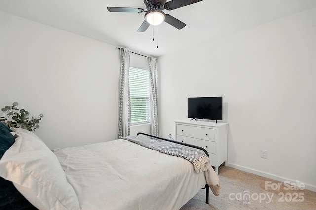 12021 Basking Dr, Charlotte, NC 28214 - bedroom featuring light carpet, baseboards, and a ceiling fan