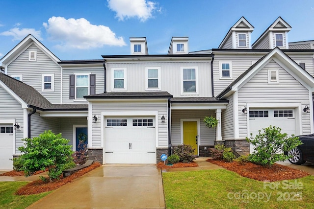 12021 Basking Dr, Charlotte, NC 28214 - view of front facade featuring an attached garage, stone siding, driveway, board and batten siding, and a front yard
