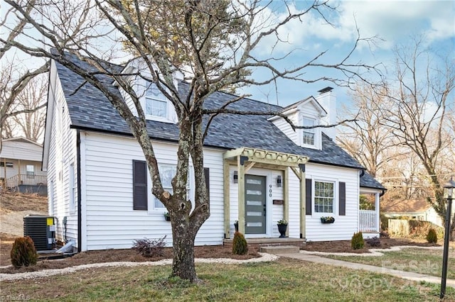 900 Gales Ave, Winston Salem, NC 27103 - cape cod home featuring a front lawn, cooling unit, and a chimney